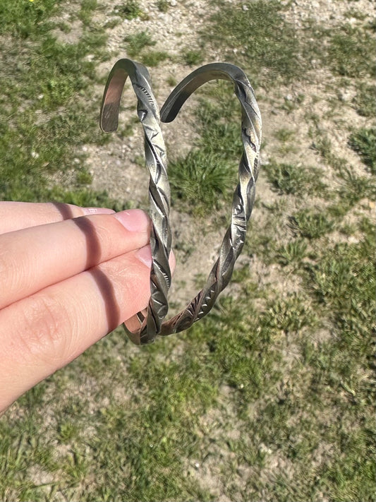 Twisted stamped cuff